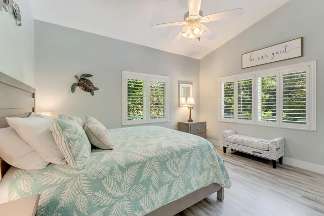 a bedroom with bed and a window