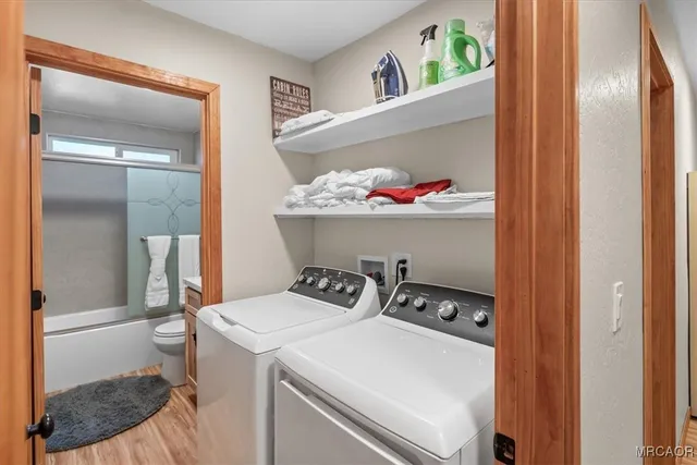 a utility room with dryer and washer