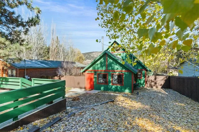 a backyard of a house with barbeque oven