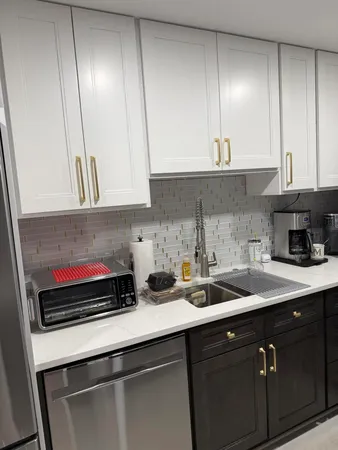 a kitchen with a sink and cabinets