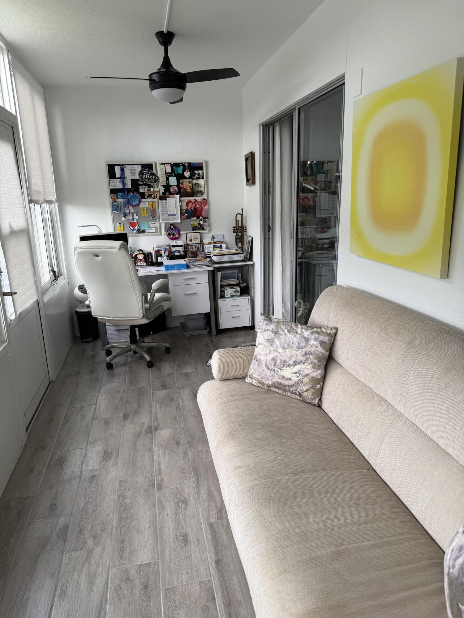1066 Ainslie Drive, Unit 1066 Boca Raton, FL 33434 - Photo 21 of 28 a living room with furniture and a wooden floor