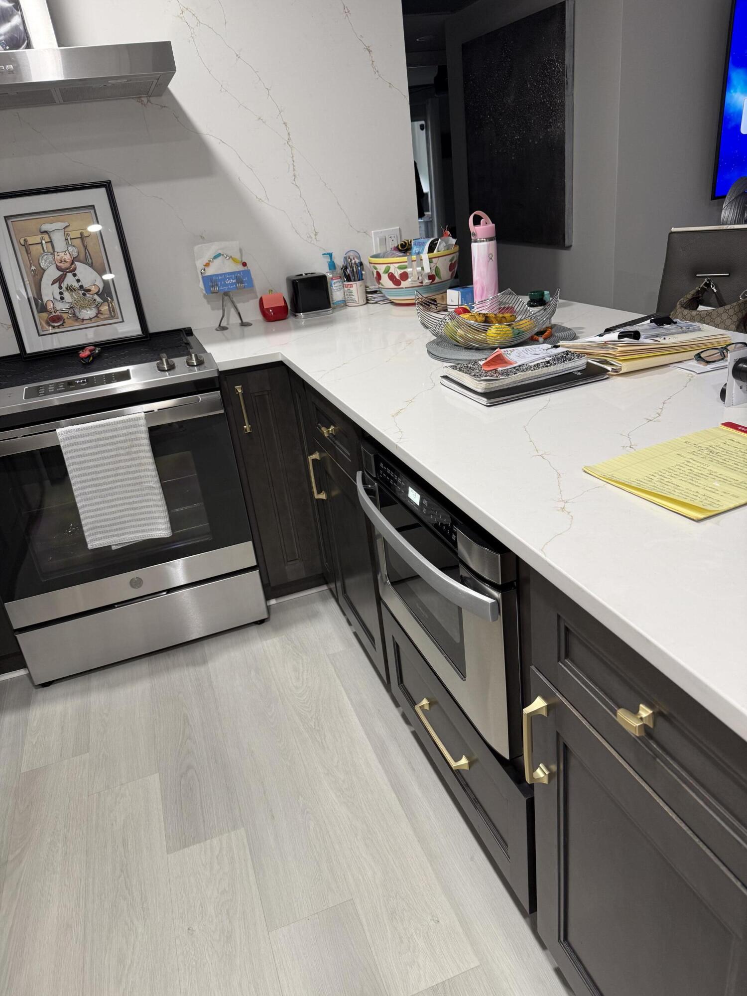 1066 Ainslie Drive, Unit 1066 Boca Raton, FL 33434 - Photo 4 of 28 a kitchen with a stove and a sink