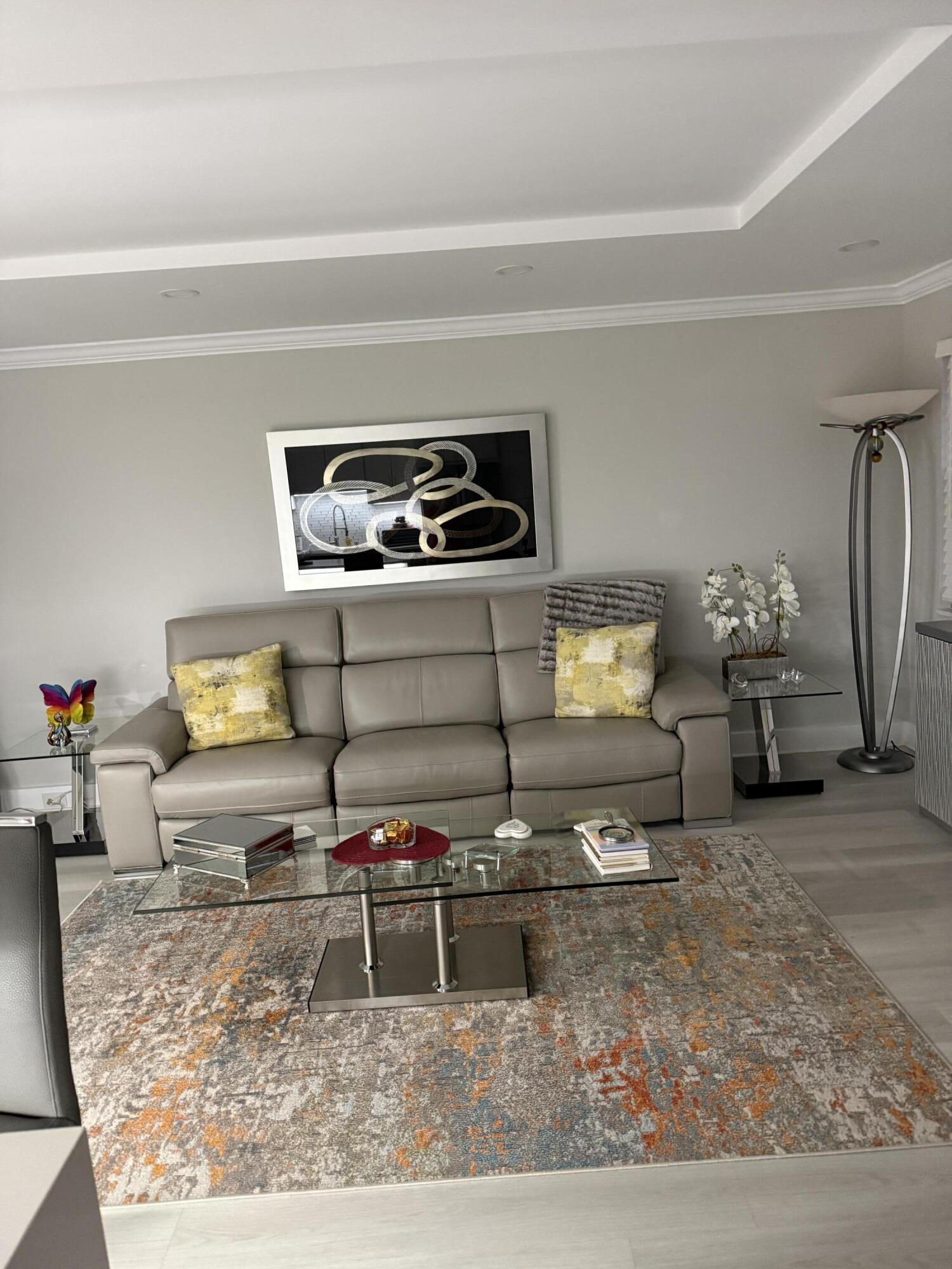 1066 Ainslie Drive, Unit 1066 Boca Raton, FL 33434 - Photo 10 of 28 a living room with furniture and wooden floor