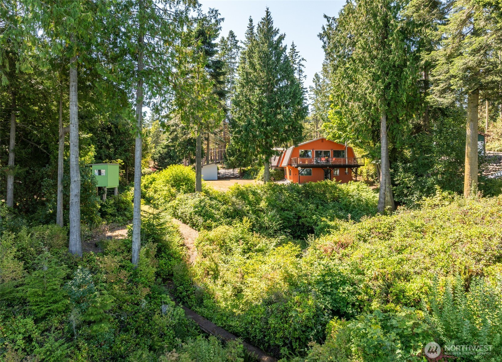 681 Bachelor Road Sequim, WA 98382 - Photo 31 of 39 an aerial view of a house with a yard and large trees