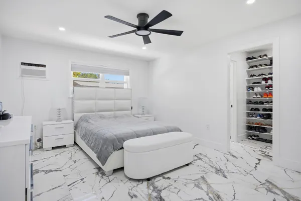 a bedroom with a bed and a dresser