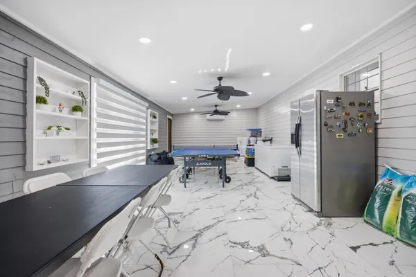 a large room with furniture and a large window