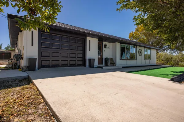 front view of a house with a yard