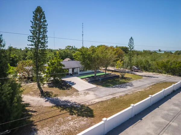 a view of a swimming pool with a yard