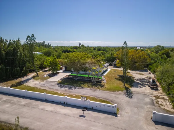 a view of swimming pool with a lounge chairs