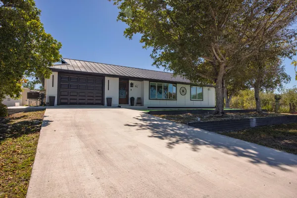 a house with trees in the background