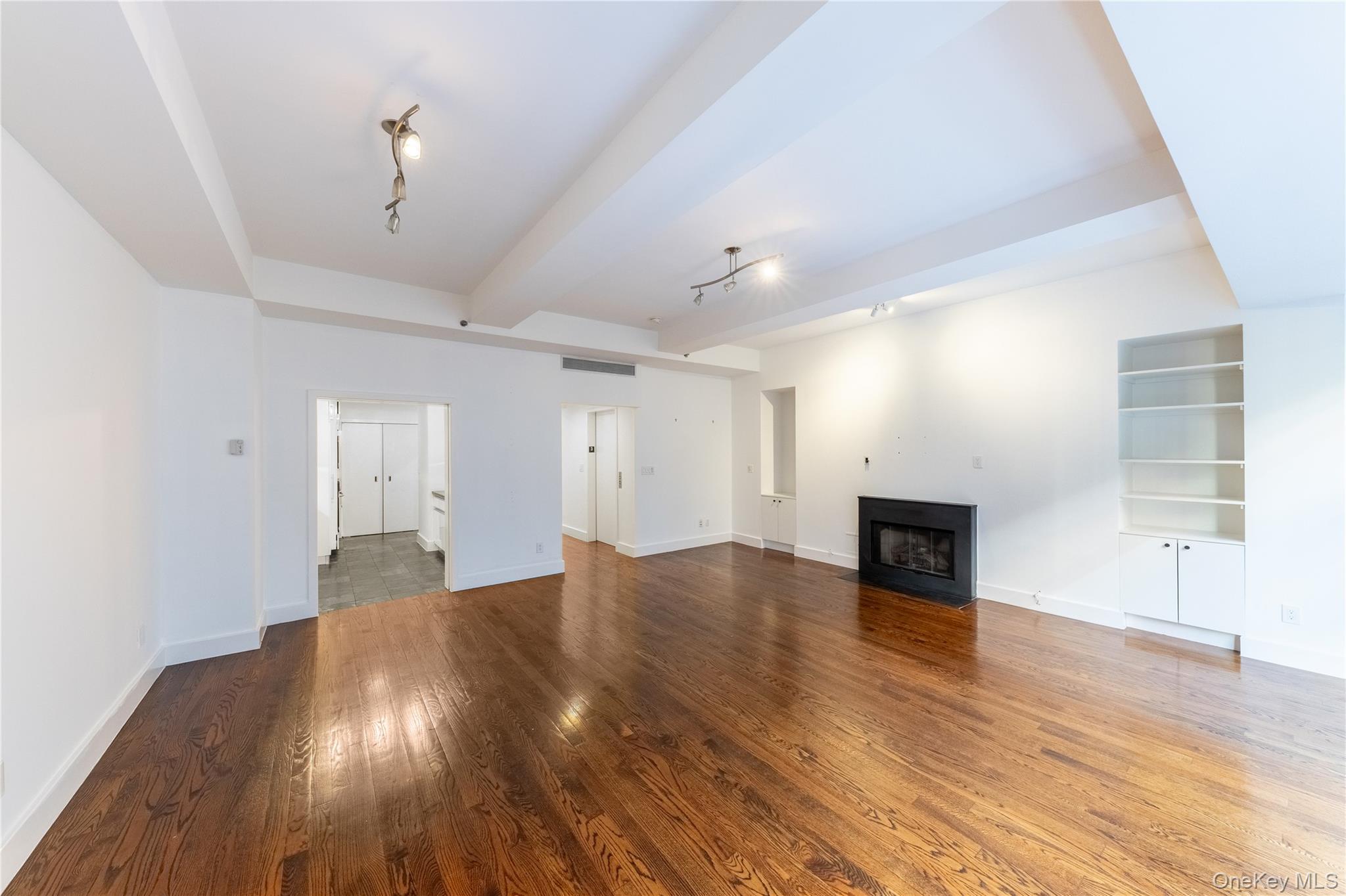 116 West 22nd Street, Unit 3 Manhattan, NY 10011 - Photo 13 of 27 a view of empty room with wooden floor