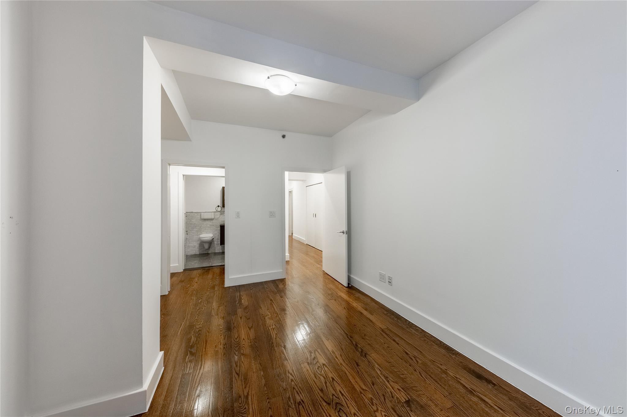 116 West 22nd Street, Unit 3 Manhattan, NY 10011 - Photo 23 of 27 a view of a hallway with wooden floor