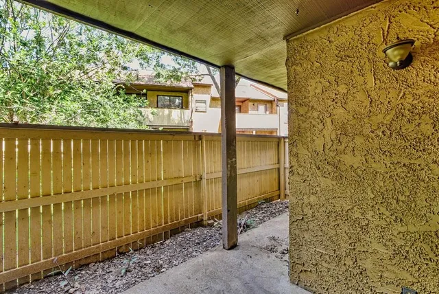 a view of a brick wall with a large window