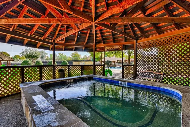 a view of a balcony with yard