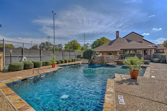 a front view of house with a garden and patio
