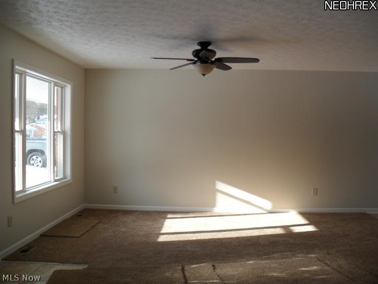 3694 Duffield Road Kent, OH 44240 - Photo 8 of 23 Formal living room features a picture window that provides natural sunlight into the room.