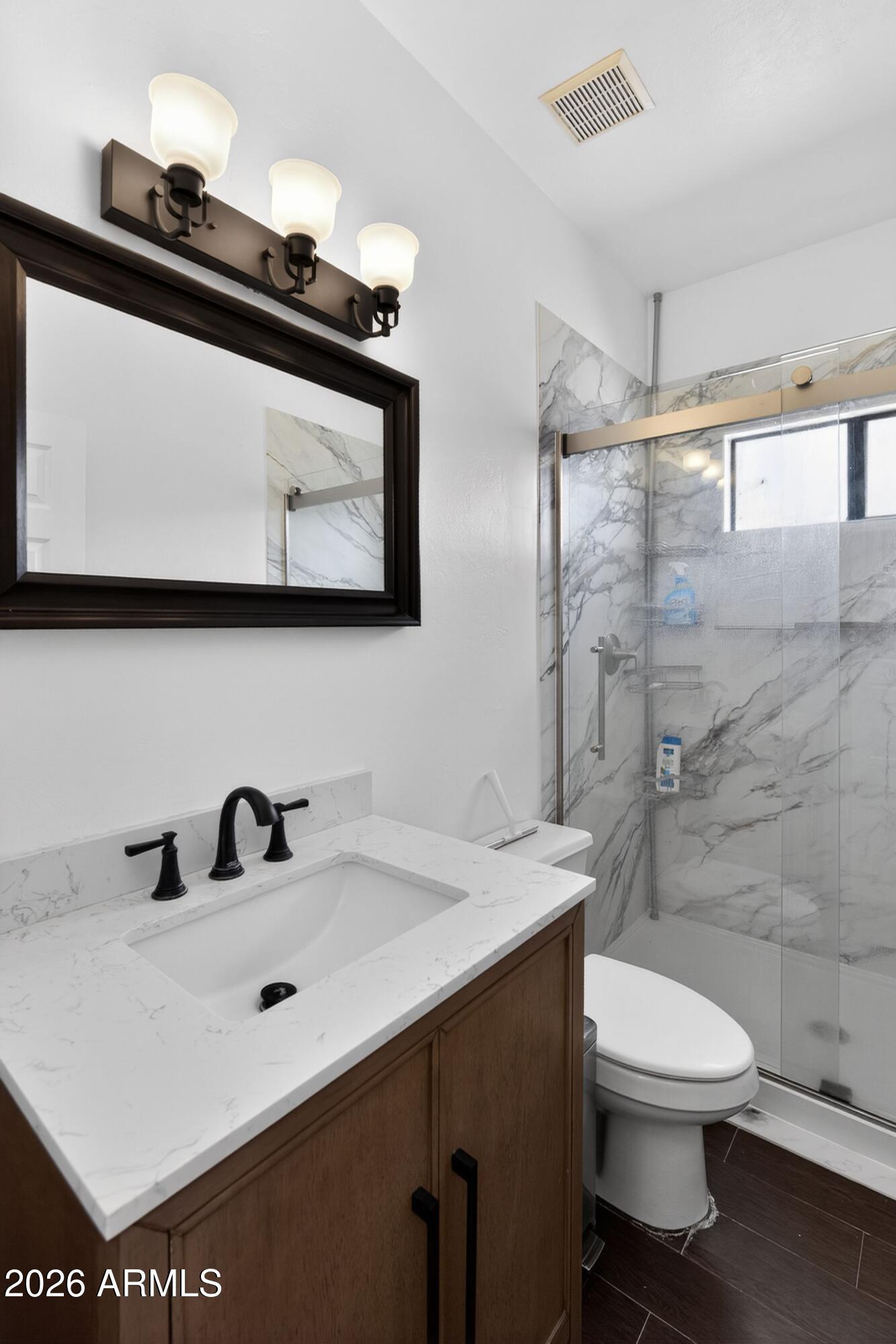 277 Círculo Silva Rio Rico, AZ 85648 - Photo 24 of 34 a bathroom with a sink a toilet and shower
