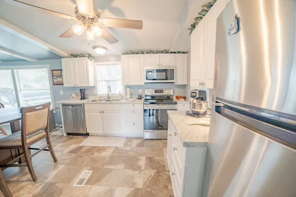 a kitchen with a sink and a stove