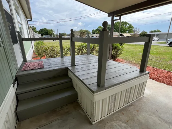 a view of a porch with furniture