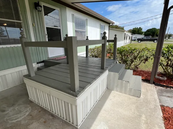 a view of balcony with furniture