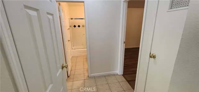 a bathroom with a shower and a door