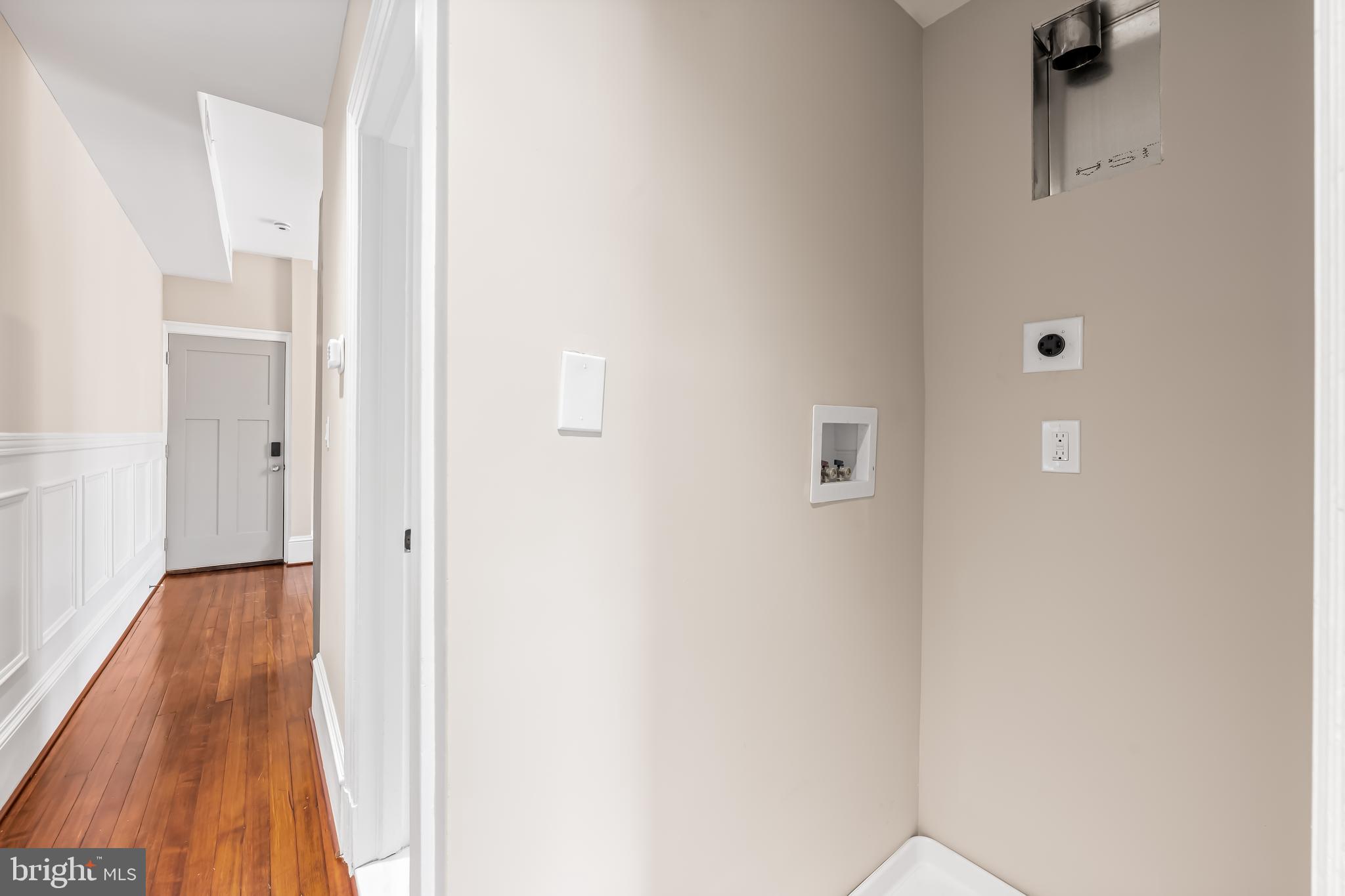 1202 Bolton Street, Unit 2 Baltimore, MD 21217 - Photo 15 of 25 a view of a hallway with wooden floor
