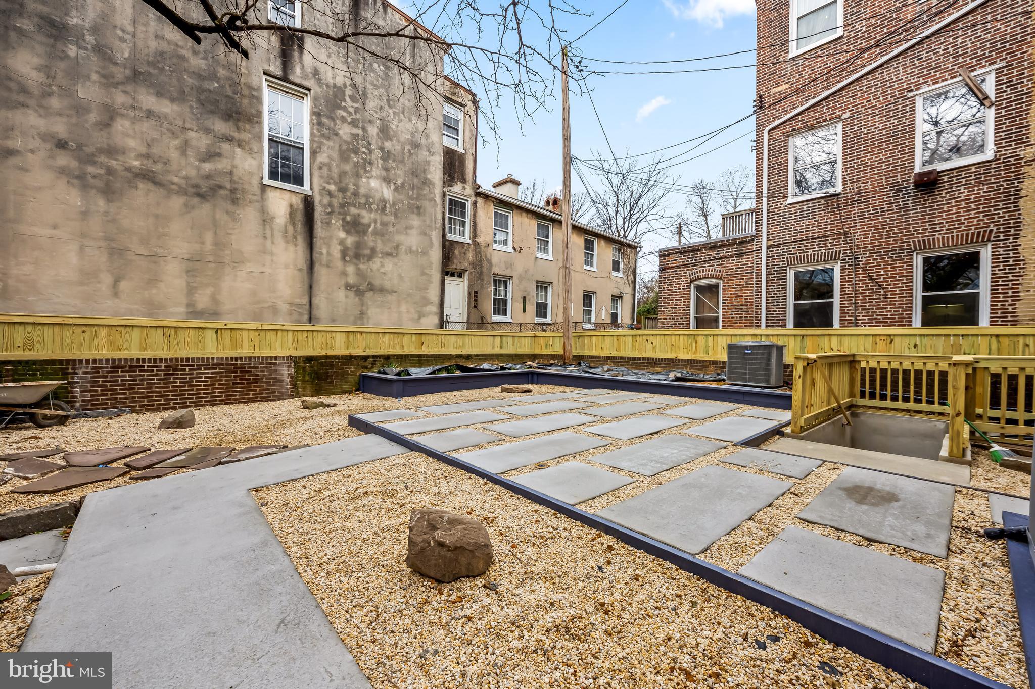 1202 Bolton Street, Unit 2 Baltimore, MD 21217 - Photo 20 of 25 a view of a swimming pool with a lounge chairs