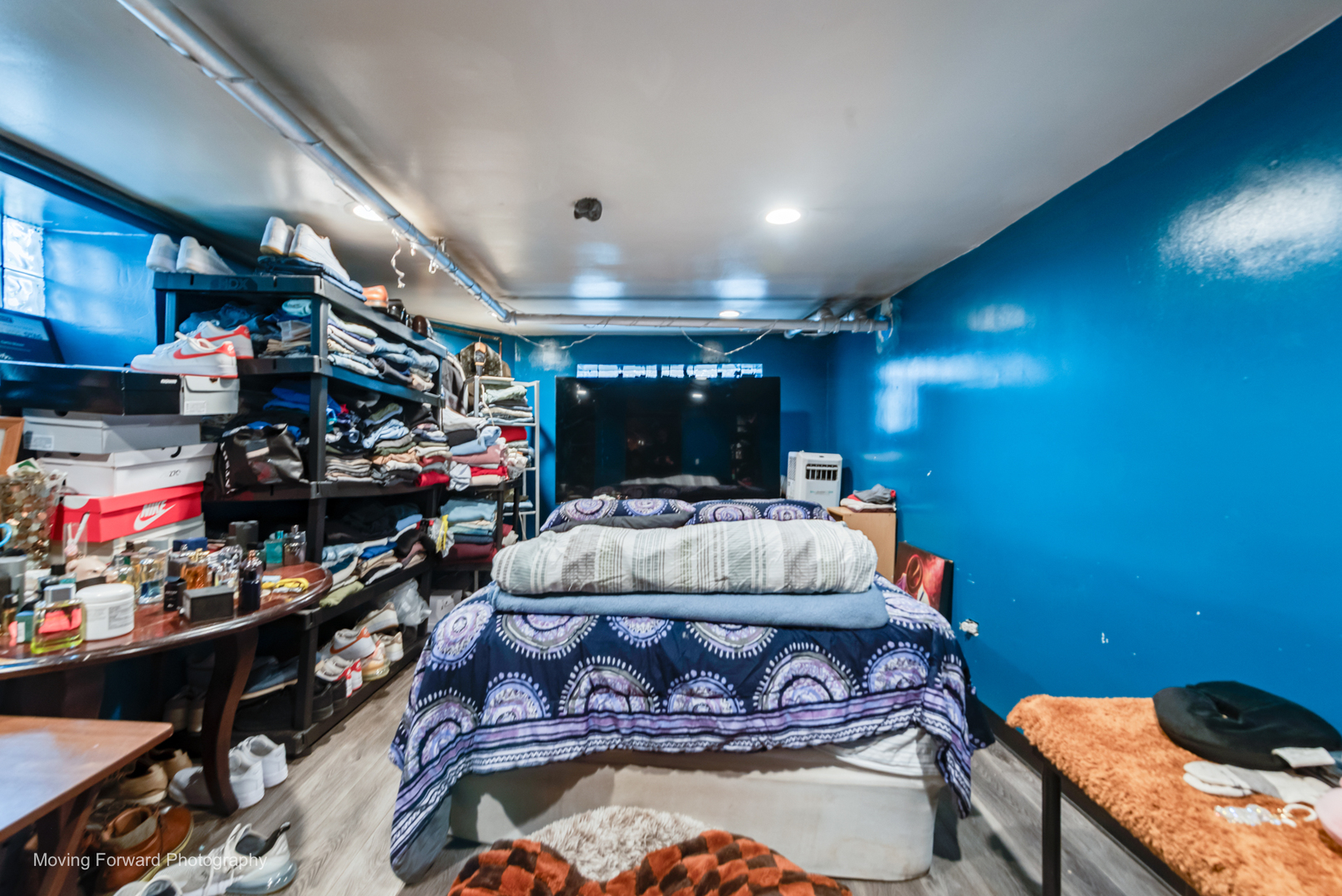 8213 South Indiana Avenue Chicago, IL 60619 - Photo 20 of 25 a bed room with a bed and a store