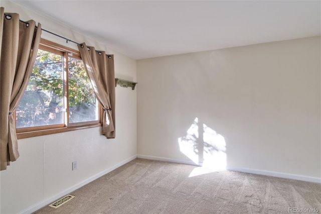 a view of empty room with a window