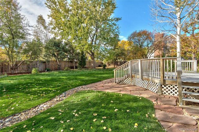 a view of a deck with a yard