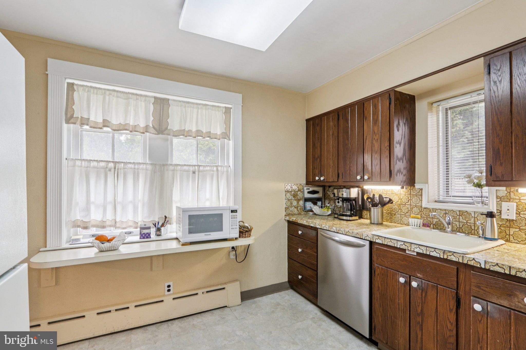 708 Meetinghouse Road Elkins Park, PA 19027 - Photo 17 of 38 a kitchen with a sink and a window