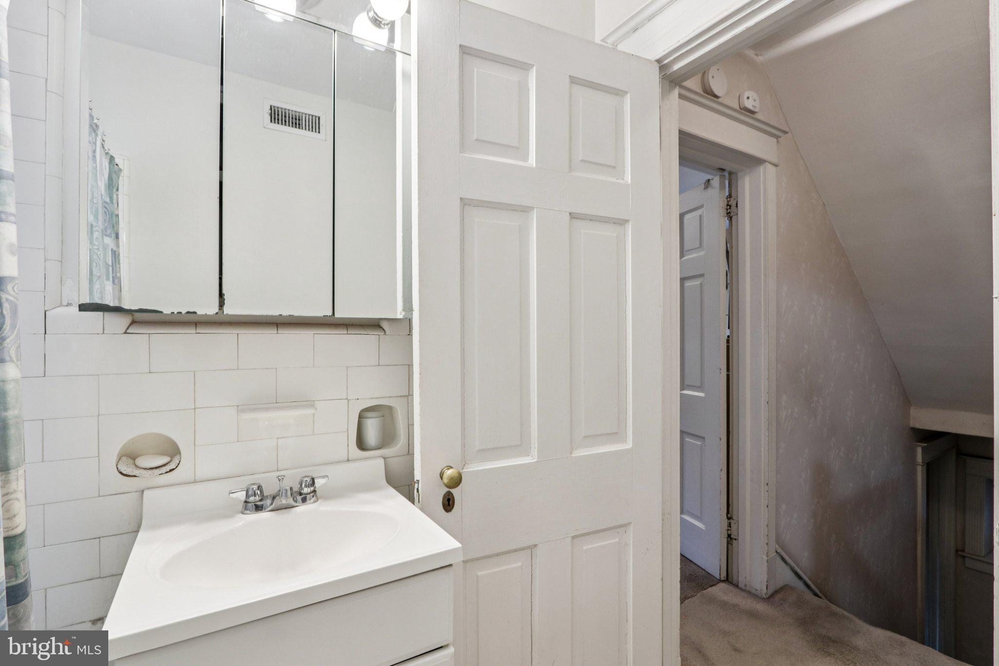 708 Meetinghouse Road Elkins Park, PA 19027 - Photo 26 of 38 a bathroom with a sink a toilet and mirror