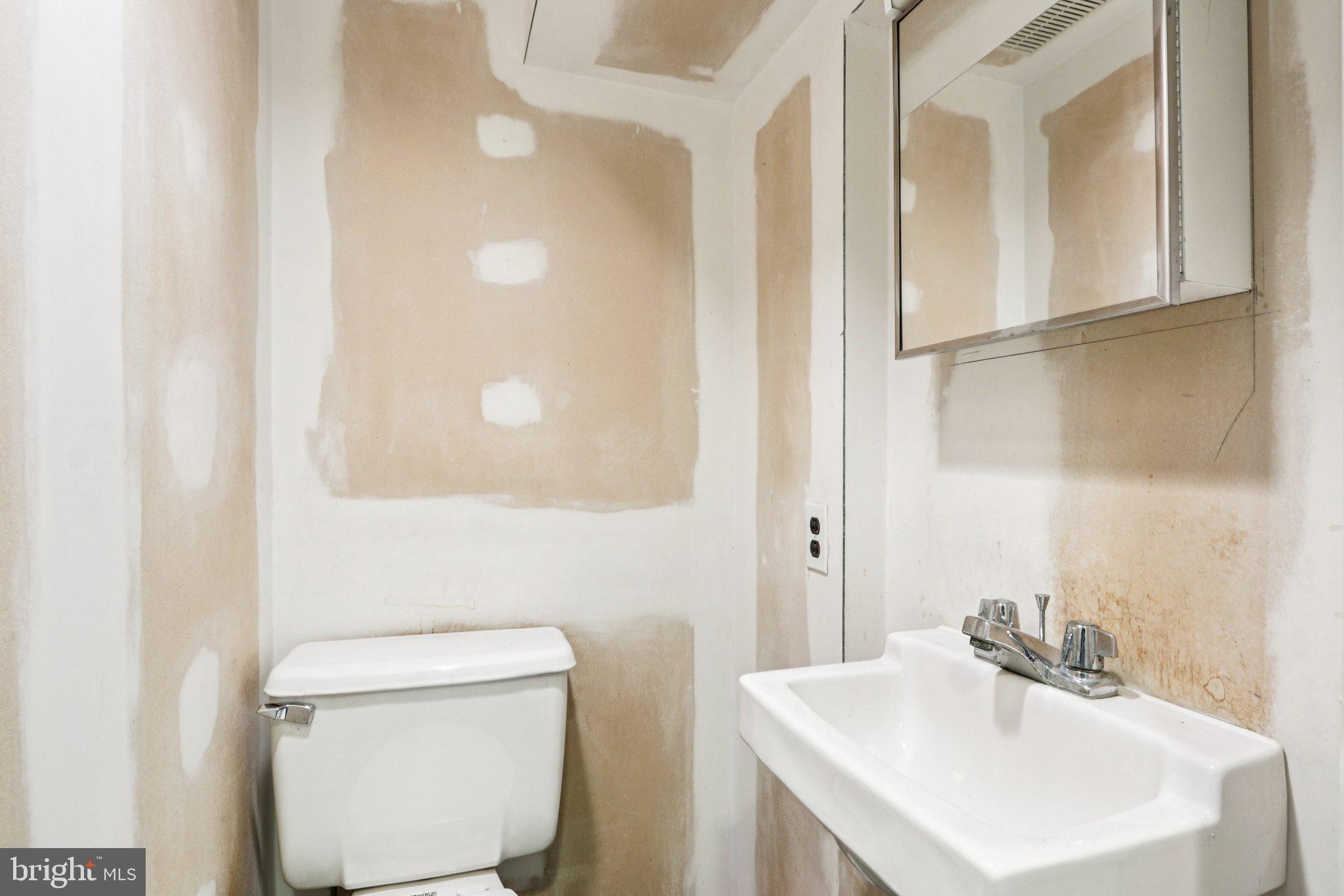 708 Meetinghouse Road Elkins Park, PA 19027 - Photo 34 of 38 a bathroom with a sink a toilet and vanity