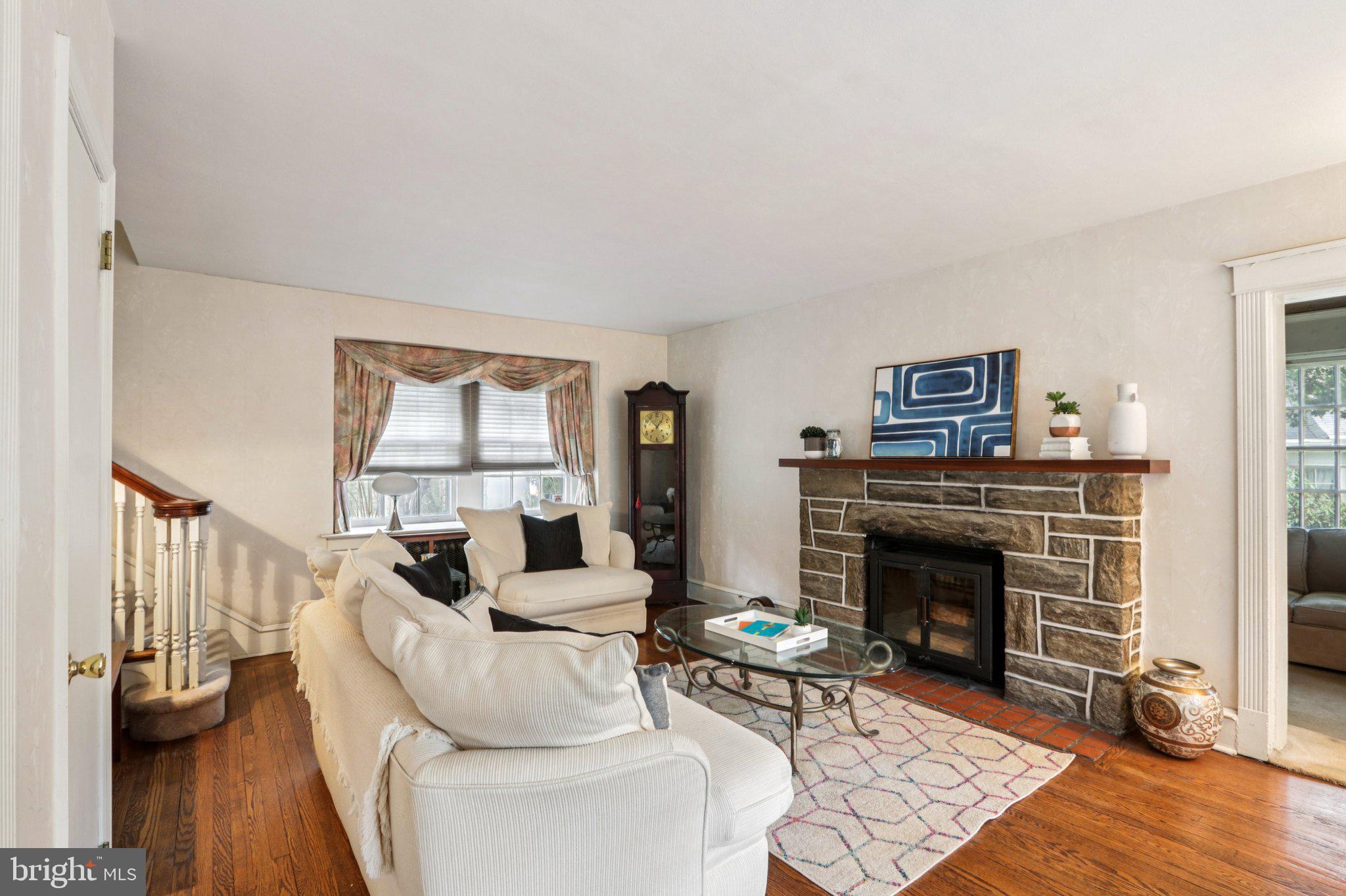 708 Meetinghouse Road Elkins Park, PA 19027 - Photo 6 of 38 a living room with furniture and a fireplace