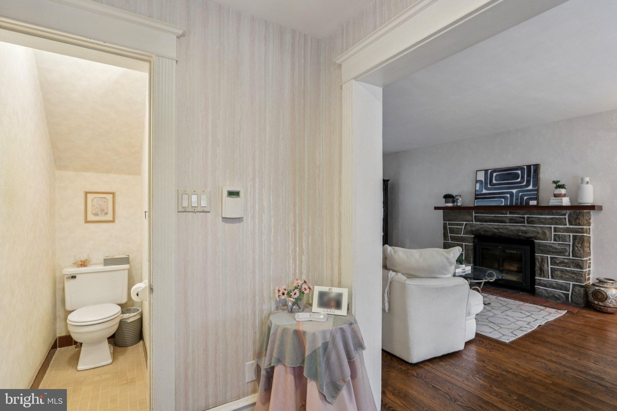 708 Meetinghouse Road Elkins Park, PA 19027 - Photo 8 of 38 a living room with furniture and a fireplace