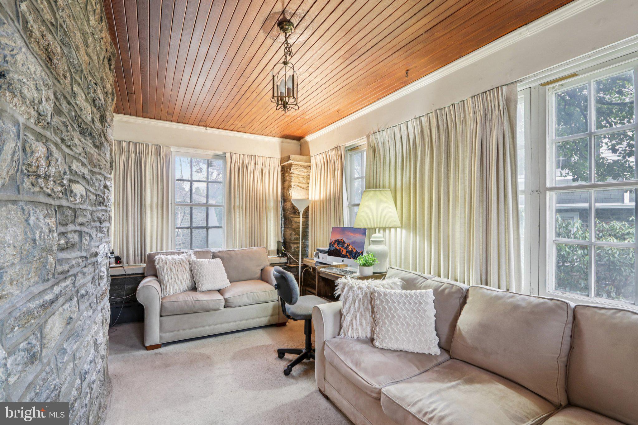 708 Meetinghouse Road Elkins Park, PA 19027 - Photo 10 of 38 a living room with furniture and a large window