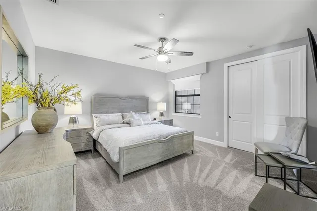 a bedroom with a bed and chair