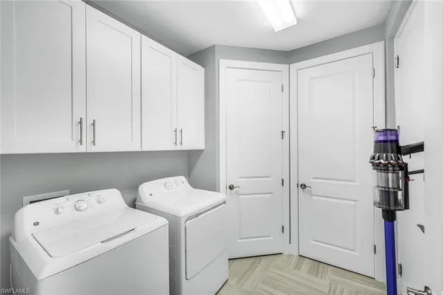 a view of storage and utility room with washer and dryer
