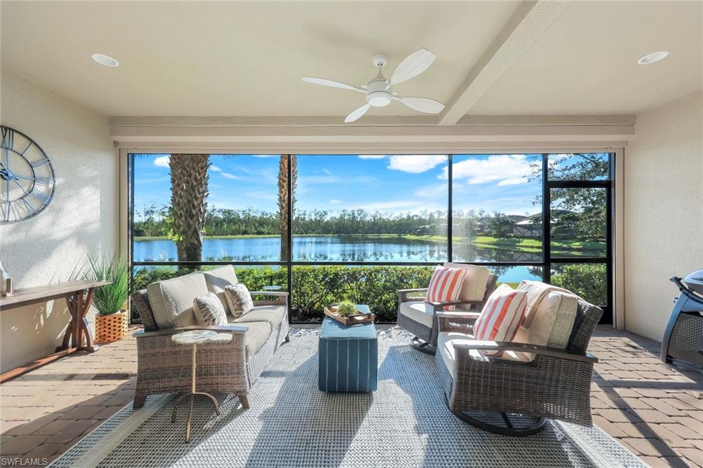9641 Montelanico Loop, Unit 103 Naples, FL 34119 - Photo 18 of 28 a balcony with furniture and a potted plant