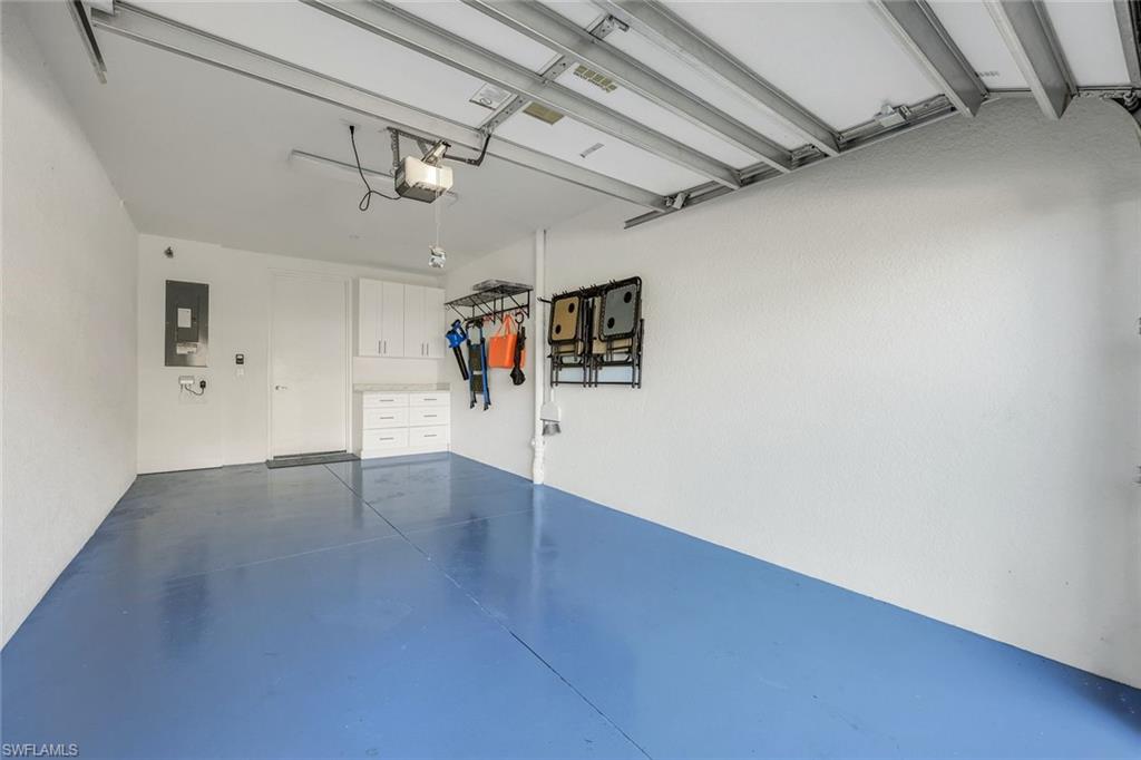 9641 Montelanico Loop, Unit 103 Naples, FL 34119 - Photo 20 of 28 a view of a hallway with wooden floor