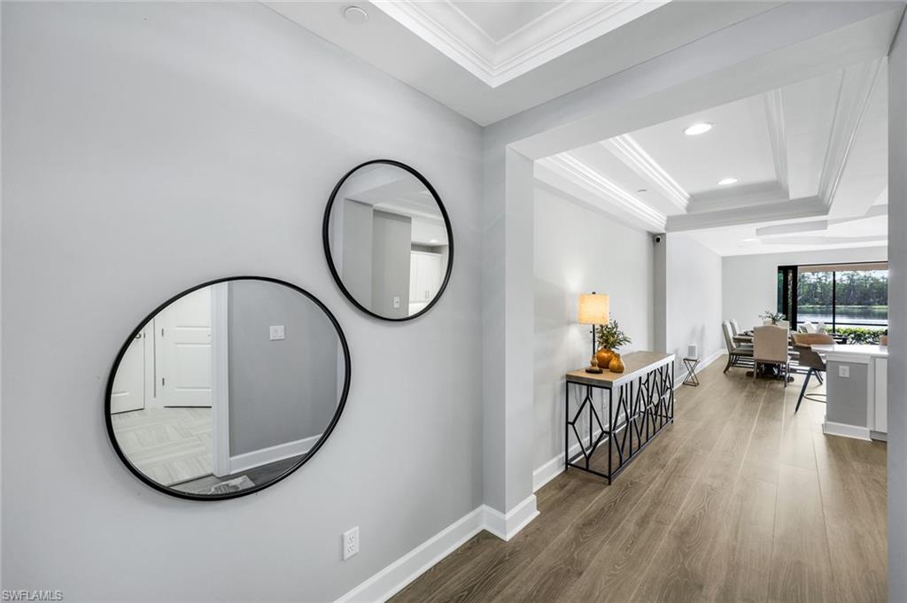 9641 Montelanico Loop, Unit 103 Naples, FL 34119 - Photo 2 of 28 a view of a livingroom with furniture and wooden floor