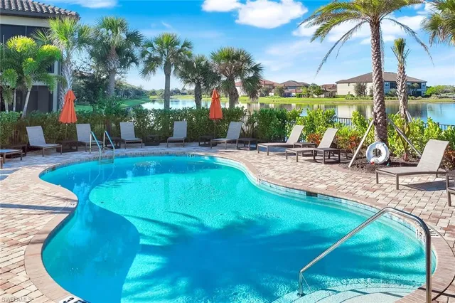 a view of a swimming pool with a patio