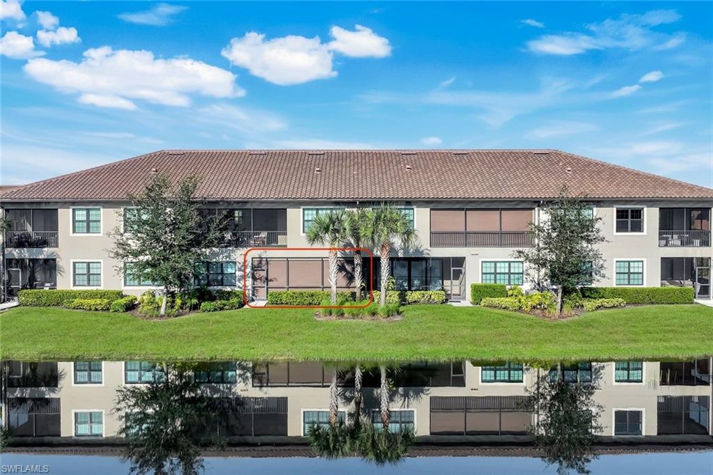 9641 Montelanico Loop, Unit 103 Naples, FL 34119 - Photo 24 of 28 a view of a house with garden space and a car park in front of it