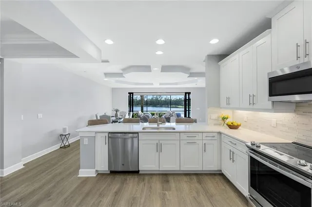 a kitchen with a sink and wooden cabinets