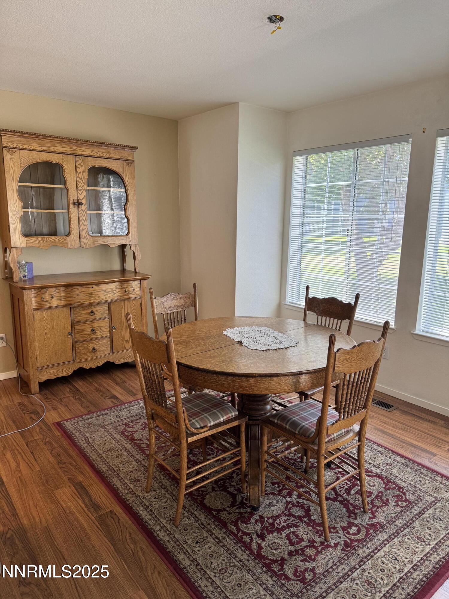 3016 Hauser Court Carson City, NV 89701 - Photo 11 of 13 a view of a dining room with furniture window and wooden floor