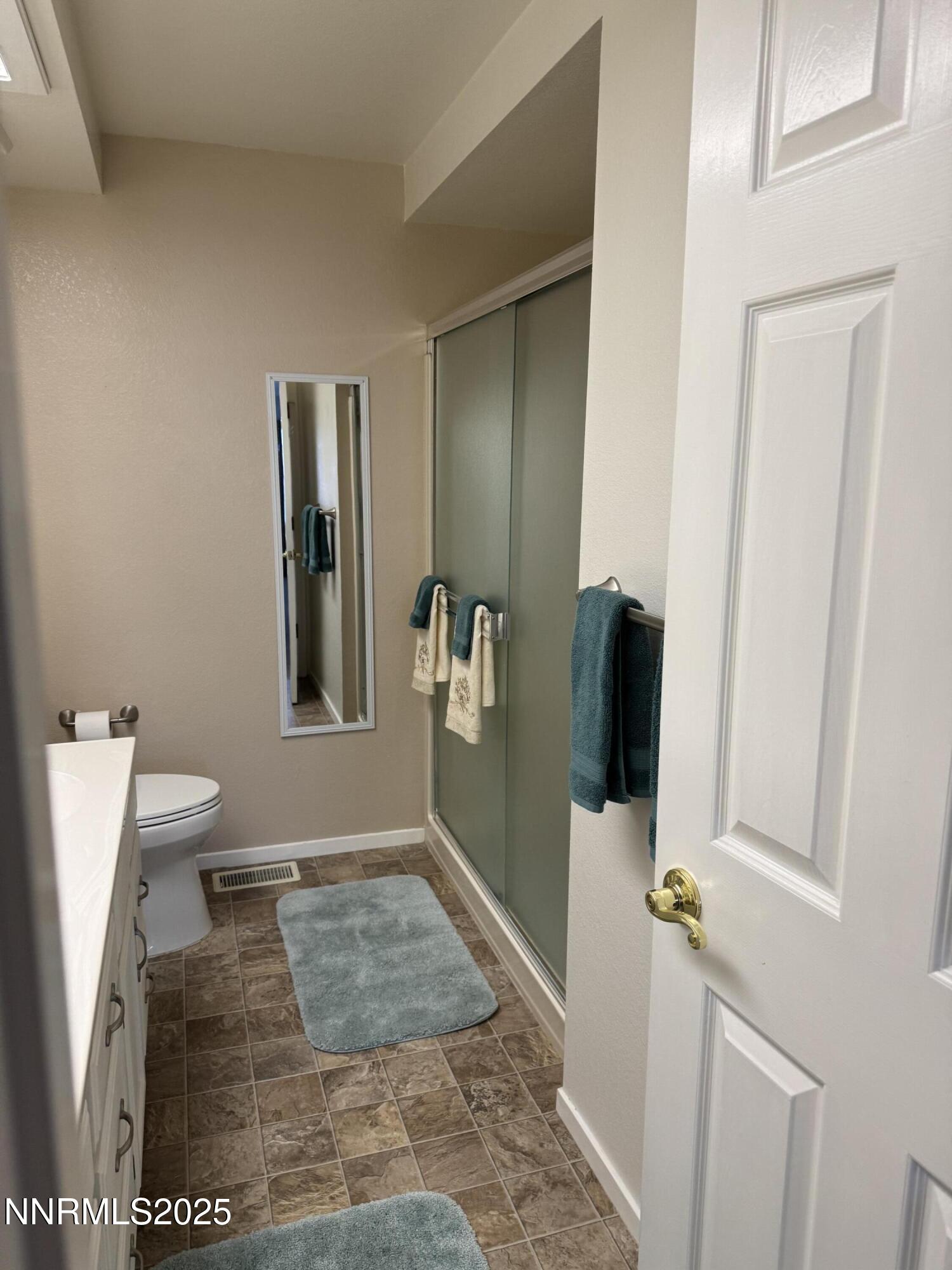 3016 Hauser Court Carson City, NV 89701 - Photo 3 of 13 a bathroom with a sink and a mirror