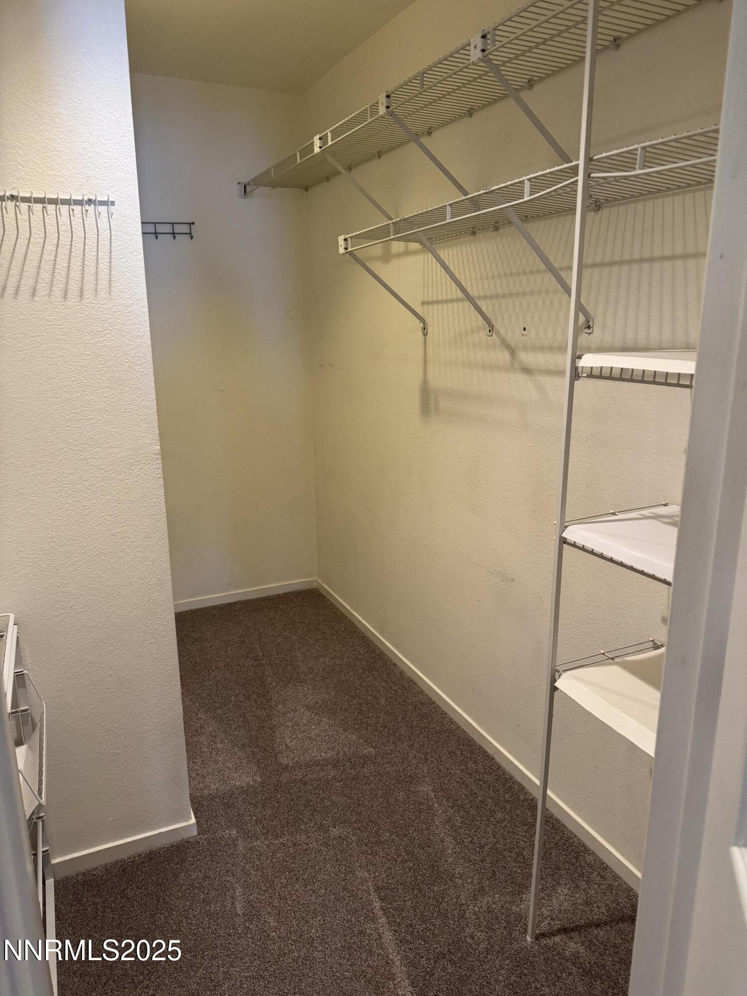 3016 Hauser Court Carson City, NV 89701 - Photo 4 of 13 a view of a room with racks on the wall