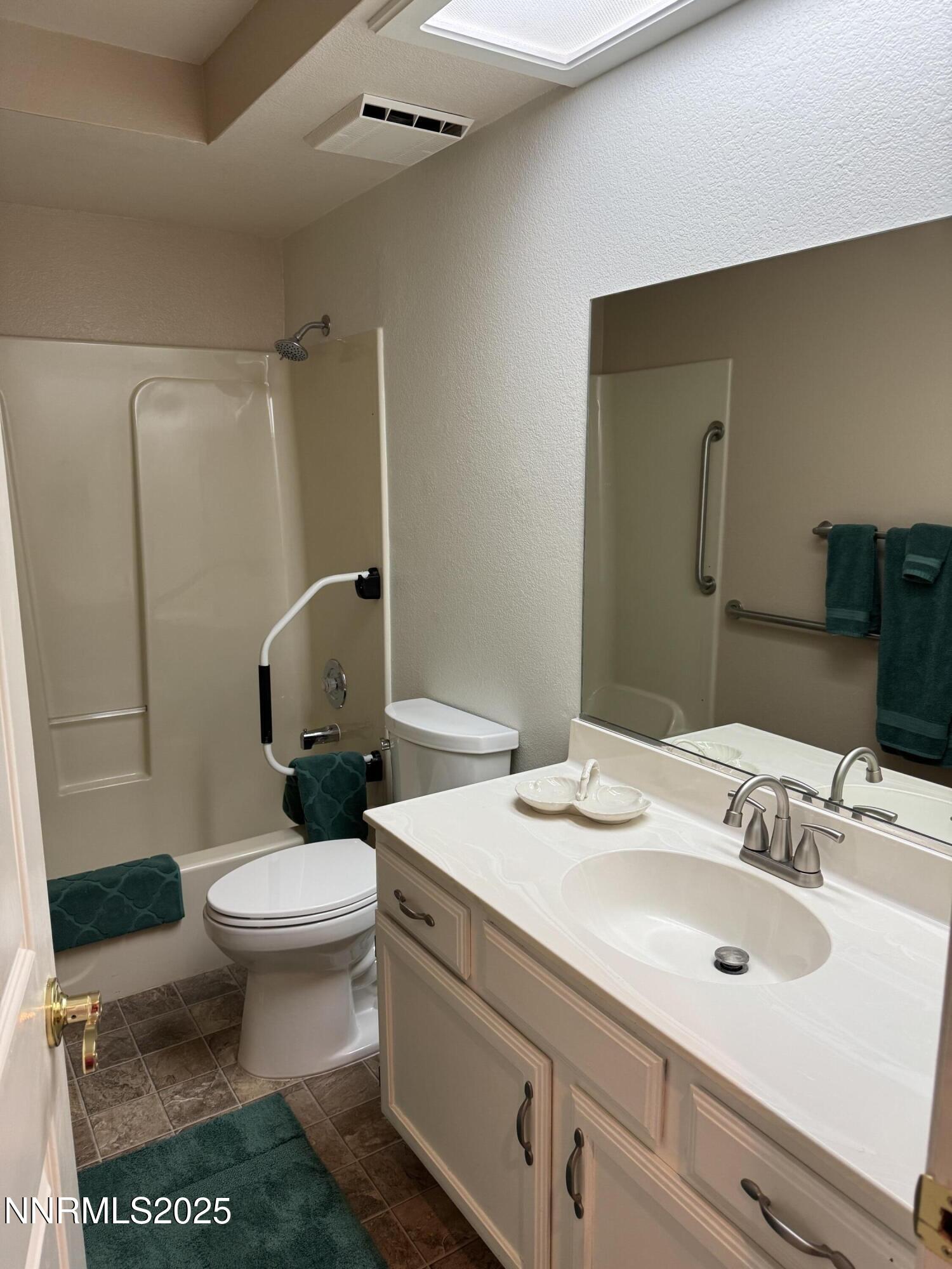 3016 Hauser Court Carson City, NV 89701 - Photo 6 of 13 a bathroom with a sink toilet and mirror