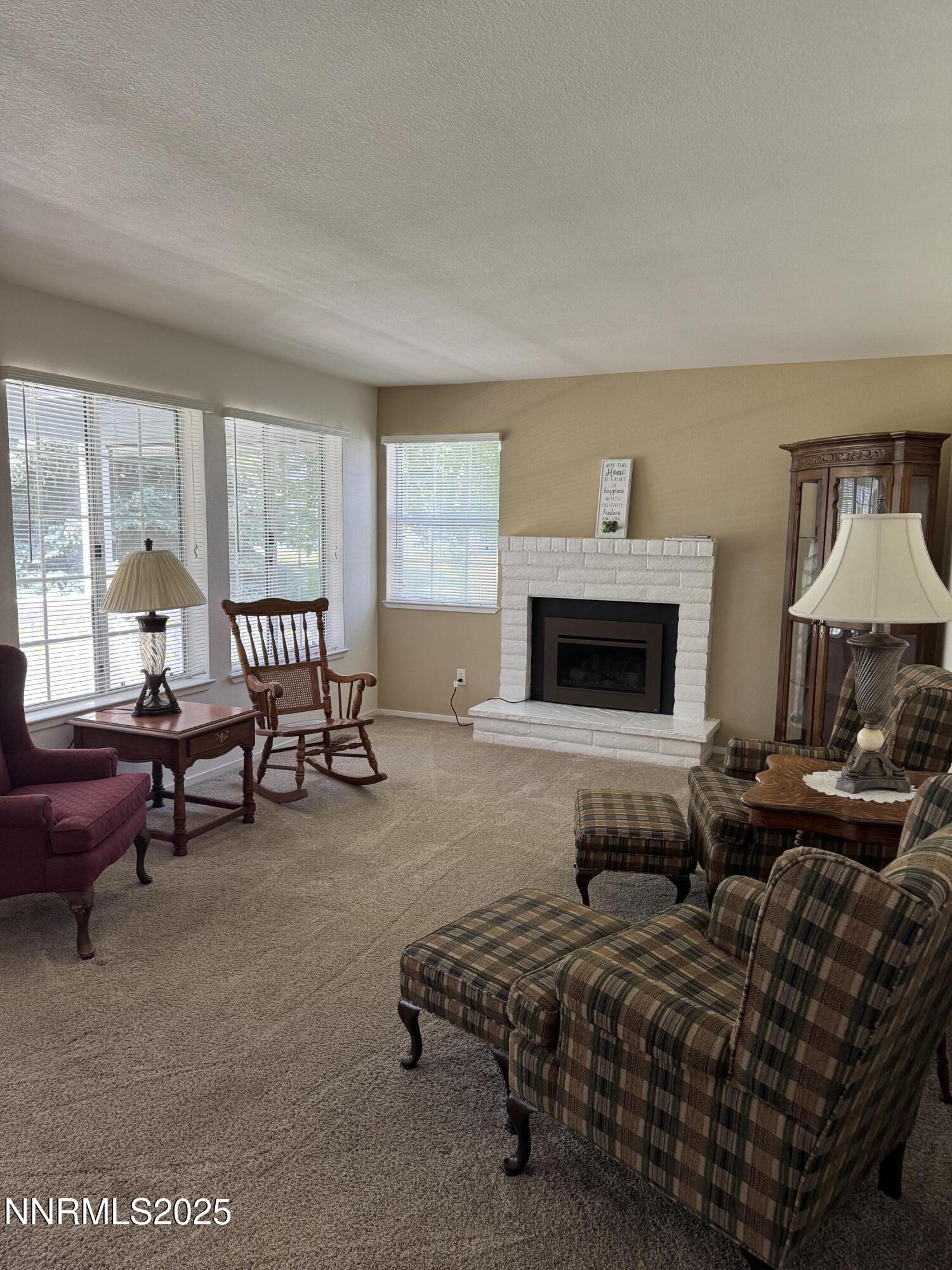 3016 Hauser Court Carson City, NV 89701 - Photo 7 of 13 a living room with furniture and a fireplace