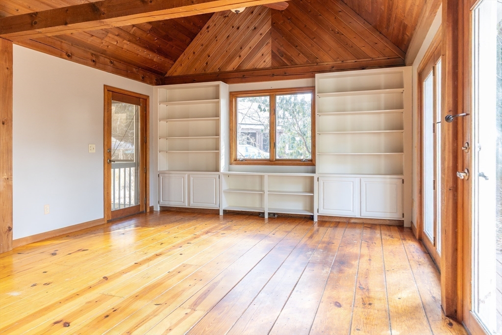 526 Station Road Amherst, MA 01002 - Photo 27 of 42 an empty room with wooden floor and windows